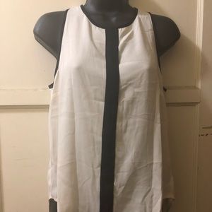 White and middle black sleeveless blouse